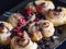 Cinnamon rolls with raspberries and blackcurrant,