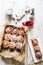 Cinnamon rolls with sugar icing  ready to be eaten for christmas holiday, top view over a white wooden    background  with a