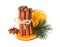 Cinnamon sticks, star anise, cloves and dried orange with artificial spruce twigs isolated on white