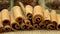 Cinnamon sticks on a surface covered with burlap. panorama close-up
