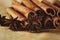 Cinnamon sticks and three stars anise on brown paper background