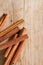 Cinnamon sticks on wooden background.