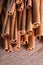 Cinnamon sticks on wooden background.