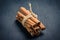 Cinnamon sticks on wooden background