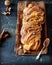 Cinnamon twisted loaf bread or babka on a dark wooden background