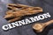 Cinnamon word in letters - brown cinnamon. Cinnamomum verum