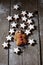 Cinnnamon stars with gingerbreadman on wooden background