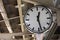 Circle black and white clock at train station