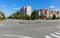 Circle at the crossroads with asphalt road and markings on a sunny day