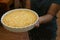 The circle dish of cracker crust in hand