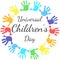 A circle of handprints with a inscription inside Universal Children`s Day. Icon of colored prints of kid`s hands on the Happy Chil