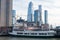 Circle Line Boat at Pier 83 in the Hudson River with the Hell`s Kitchen and Hudson Yards Skyline