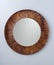 Circle mirror created by brown wood frame