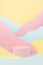 Circle pink podium mockup with abstract mountain landscape - pastel pink, yellow, mint color slopes in baby cartoon naive style.