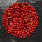 Circle of red rosehip berries. circle of rose hips on a background of baking sheet metal.