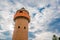 Circle Tower made of orange brick and blue sky background