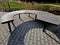 circular bench made of brown-red teak wood. tropical impregnated