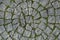 Circular cobblestone texture with grass