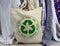 Circular Economy Textiles on fabric bag make, use, reuse, swap, donate, recycle with eco clothes recycle icon sustainable fashion