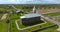 circular flight and aerial view on gothic temple or catholic church in countryside near cemetery