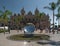 A circular fountain with majestic palm trees: Monte Carlo casino in Monaco