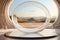 A circular glass sculpture in a desert setting.