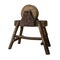 Circular grindstone on serious wooden stand . Very vintage work tool.