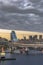 Circular highway leading to the Rainbow Bridge with Cargo and cruise ships moored in Odaiba Bay of Tokyo