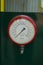 A circular industrial temperature meter
