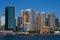 Circular Quay cityscape, Sydney Harbor. City waterfront. Iconic skyline of downtown skyscrapers. Ferry in water. CBD coastline