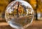 Circular shot of a forest with falling leaves in fall through the perspective of a glass ball