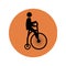 Circular silhouette with man in penny farthing