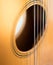 Circular vents on the acoustic guitar and guitar strings