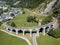 The circular viaduct - the famous railway construction in Swiss Alps mountain,