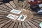 Circular wooden table with four colored cards, people enjoy traditional Neapolitan cards and play trump game