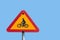 Circular yellow warning sign and a blue sky. Sign features a picture of a bicycle