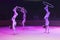 Circus acrobats in bright ultraviolet rays
