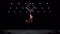 Circus aerial cube duo on black background performing tricks. Man and women fly on stage