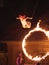 Circus artist flying through fire cicle