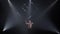 Circus male muscular performer making tricks with juggling cube props at black background. Concept of concentration