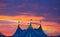 Circus tent in a dramatic sunset sky colorful