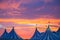 Circus tent in a dramatic sunset sky colorful