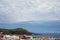 Cirrocumulus of clouds over the sea village at sunrise. Cloudscape, landscape, pictorial.