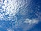 Cirrus aerial white clouds against a blue sky