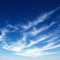 Cirrus clouds in blue sky.