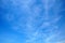 Cirrus clouds on the blue sky background.