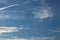 Cirrus clouds on a clear blue sky. Weather forecast. Water in a gaseous state in nature. The atmosphere of the earth. The effect o