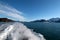 Cirrus clouds over boat wake and exhaust in Resurrection Bay on the Kenai Peninsula in Seward Alaska USA