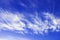 Cirrus fibratus, cirrus clouds in Latin language. Cloud formation, background with blue sky and cirrus clouds. Upper atmosphere, t