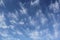 Cirrus Uncinus Clouds in Blue Sky
